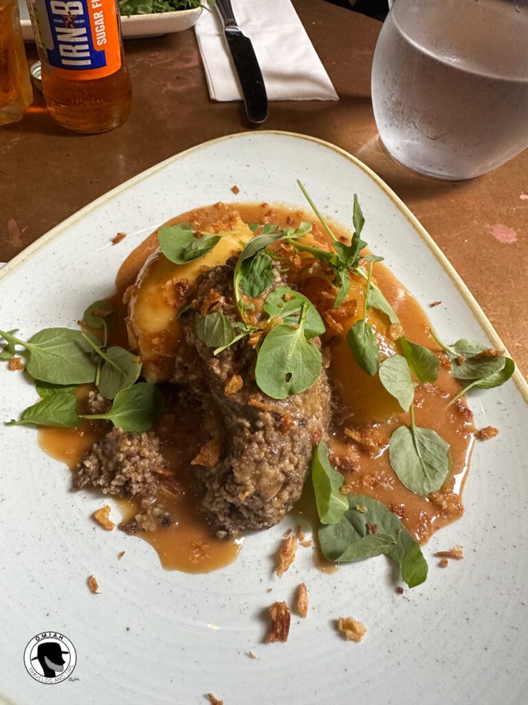 Dishes to try in Scotland, picture of Haggis, Neeps and Tatties in Whisky sauce.