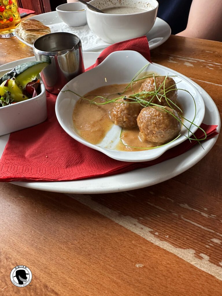 Dishes to try in Scotland, picture of Haggis bon bons, with whisky sauce.