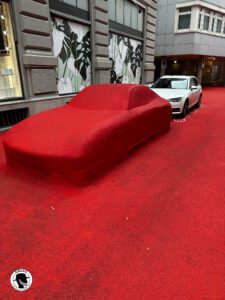 a red coated car that is part of the Ciy-Lounge- Red Square