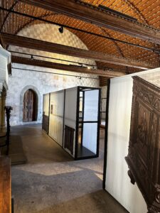 Large room with collection of chests in the Chateau de Chillon