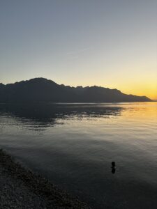 sunset looking over Lage Geneva taken from Montreux with mountains across the lake serving as the backdrop.