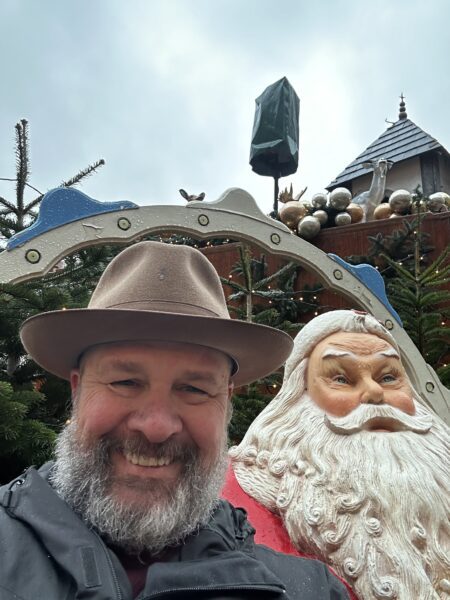 Picture of the author with Santa statue